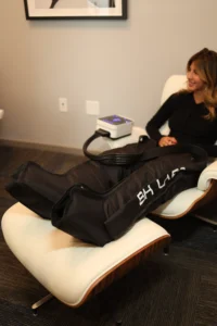 client using compression therapy boots for recovery and improved circulation