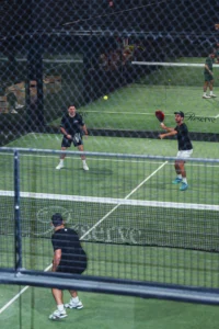 athletes playing padel on court during training and competitive gameplay