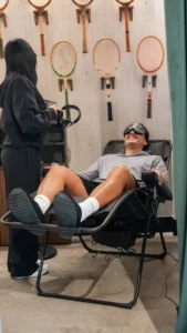 athlete using brain relaxation device for stress relief and cognitive recovery