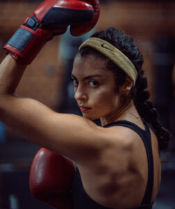 woman boxing workout focused on strength, conditioning, and performance